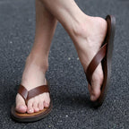 Dark brown leather flip-flops