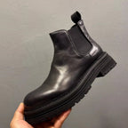 Men's leather Chelsea boots, with thick soles and a fully enclosed upper, a casual high-top style