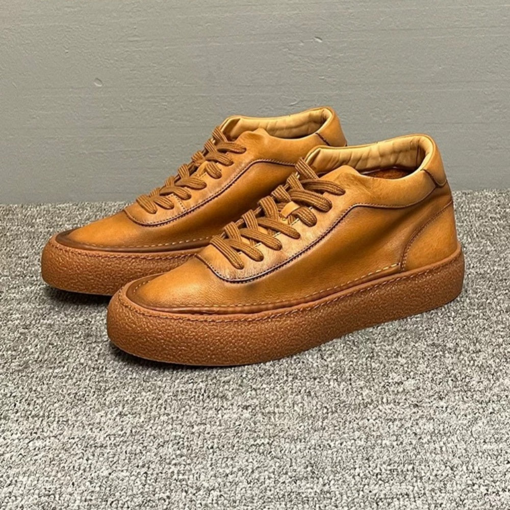 High-top green men's leather boots, designed to be comfortable and soft, are a casual style of boots.