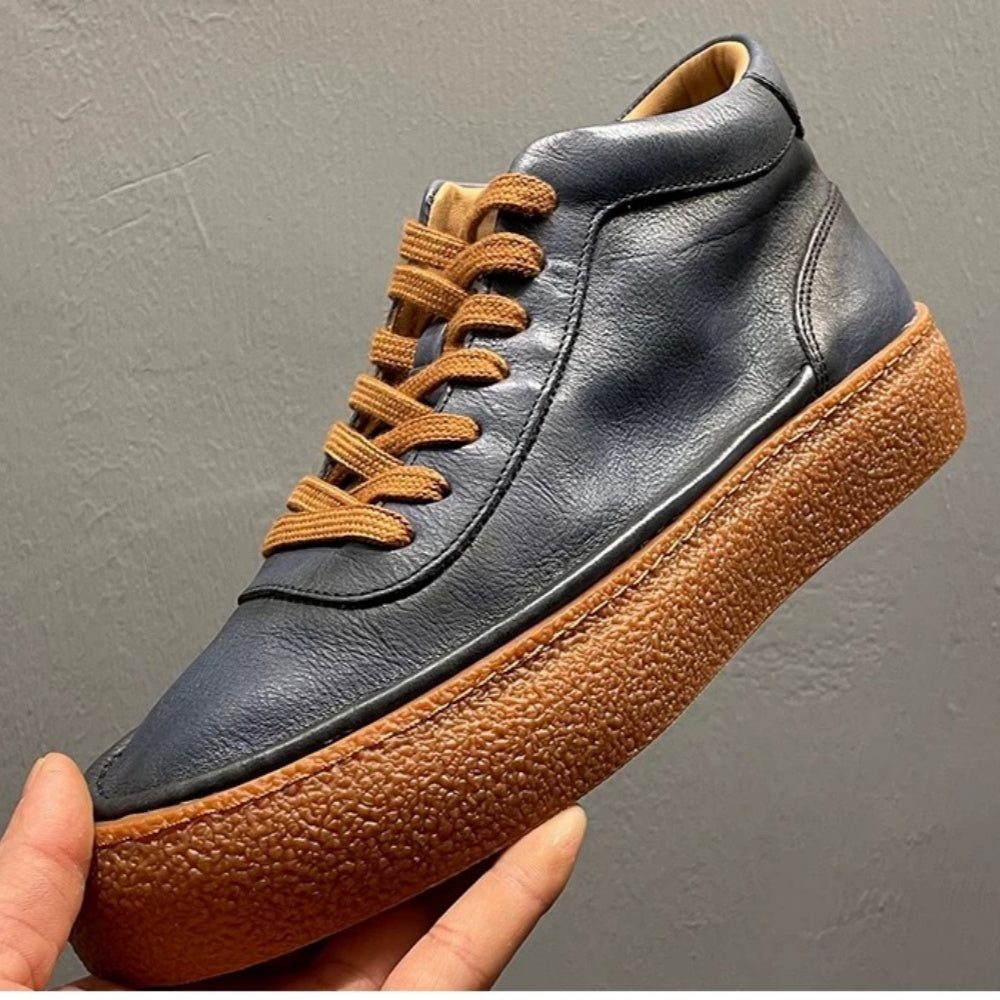 High-top green men's leather boots, designed to be comfortable and soft, are a casual style of boots.