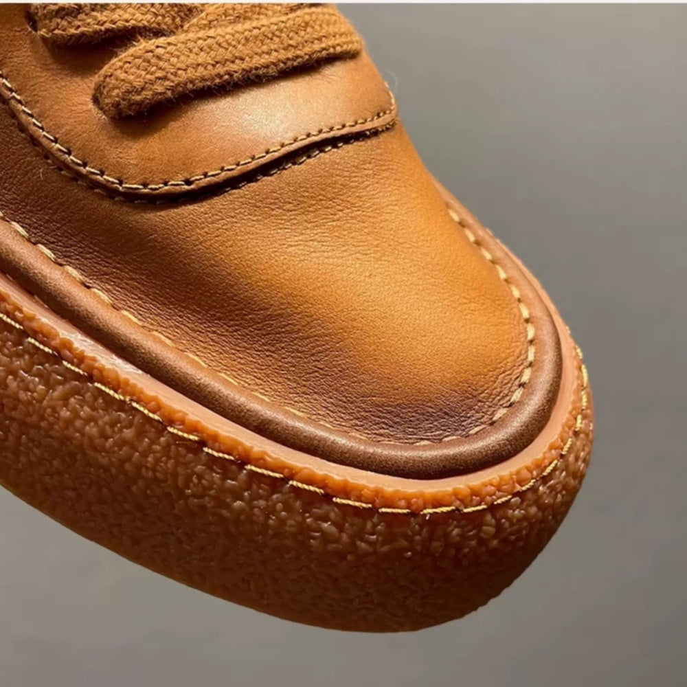 High-top green men's leather boots, designed to be comfortable and soft, are a casual style of boots.