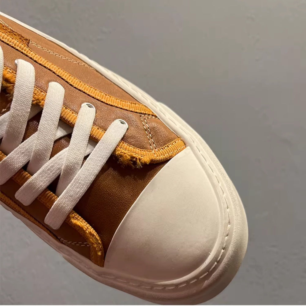 This new model of casual sports shoes features a thick leather sole and a genuine leather upper.