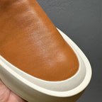 New men's high-quality leather casual loafers. Made of genuine leather. Shoes with a thick sole design.