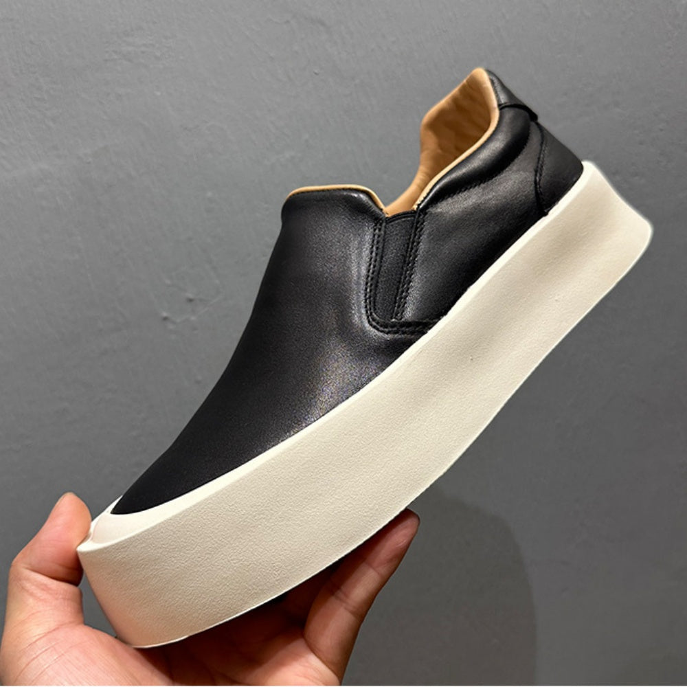 New men's high-quality leather casual loafers. Made of genuine leather. Shoes with a thick sole design.