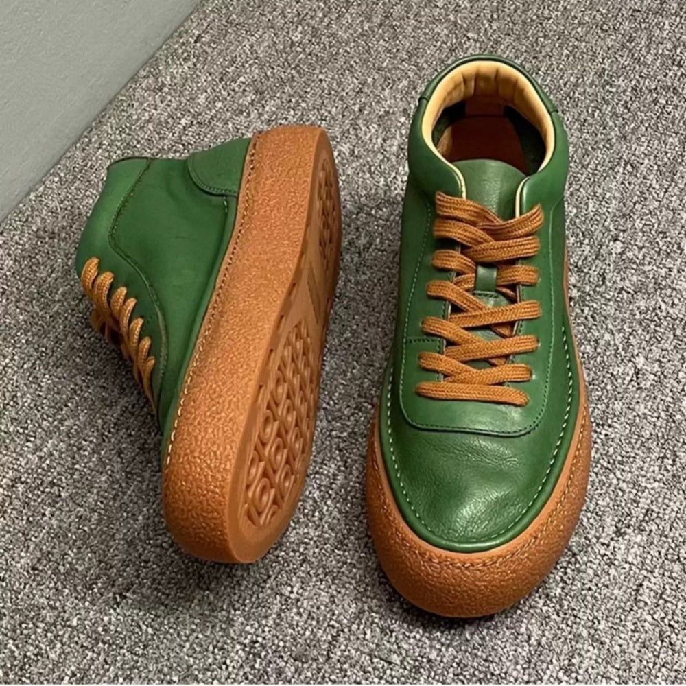 High-top green men's leather boots, designed to be comfortable and soft, are a casual style of boots.