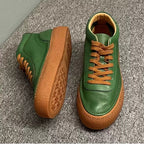 High-top green men's leather boots, designed to be comfortable and soft, are a casual style of boots.