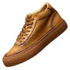 High-top green men's leather boots, designed to be comfortable and soft, are a casual style of boots.