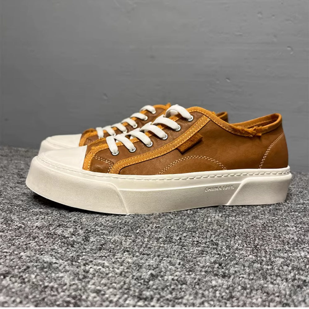 This new model of casual sports shoes features a thick leather sole and a genuine leather upper.
