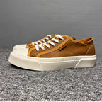 This new model of casual sports shoes features a thick leather sole and a genuine leather upper.