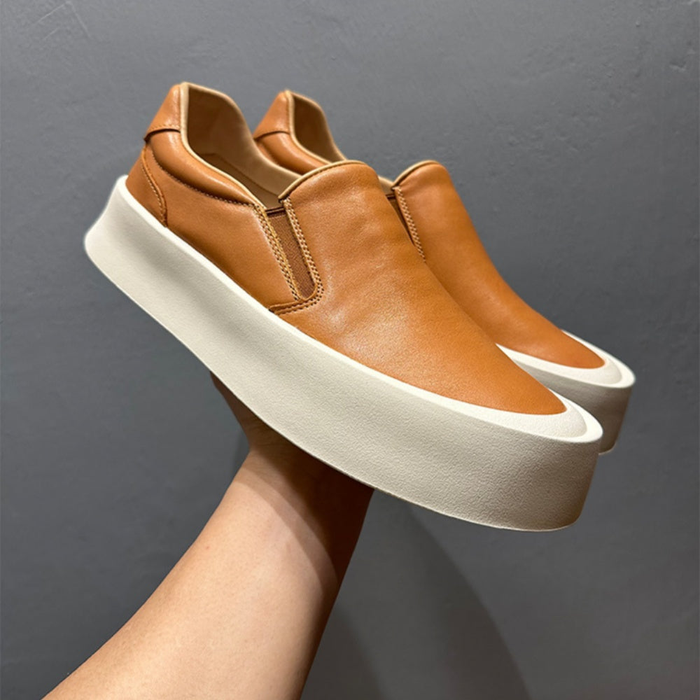 New men's high-quality leather casual loafers. Made of genuine leather. Shoes with a thick sole design.