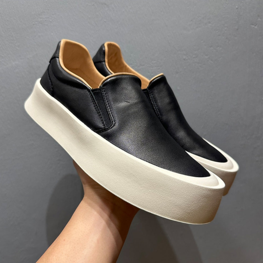 New men's high-quality leather casual loafers. Made of genuine leather. Shoes with a thick sole design.