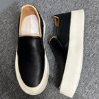 New men's high-quality leather casual loafers. Made of genuine leather. Shoes with a thick sole design.