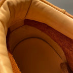 High-top green men's leather boots, designed to be comfortable and soft, are a casual style of boots.