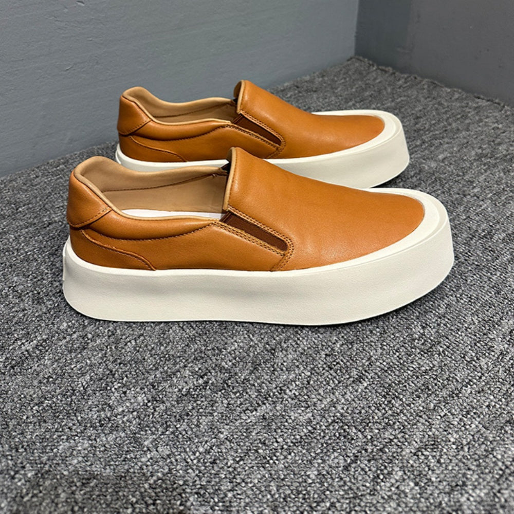 New men's high-quality leather casual loafers. Made of genuine leather. Shoes with a thick sole design.