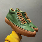 High-top green men's leather boots, designed to be comfortable and soft, are a casual style of boots.