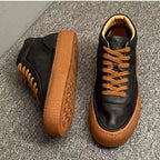 High-top green men's leather boots, designed to be comfortable and soft, are a casual style of boots.