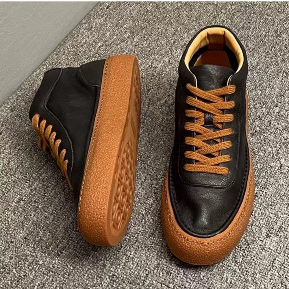 High-top green men's leather boots, designed to be comfortable and soft, are a casual style of boots.